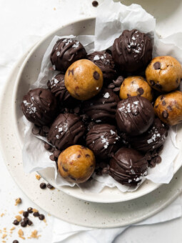 cookie dough in a white bowl on a linen cloth