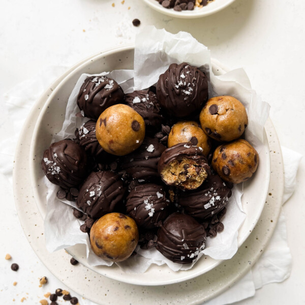 cookie dough in a white bowl on a linen cloth