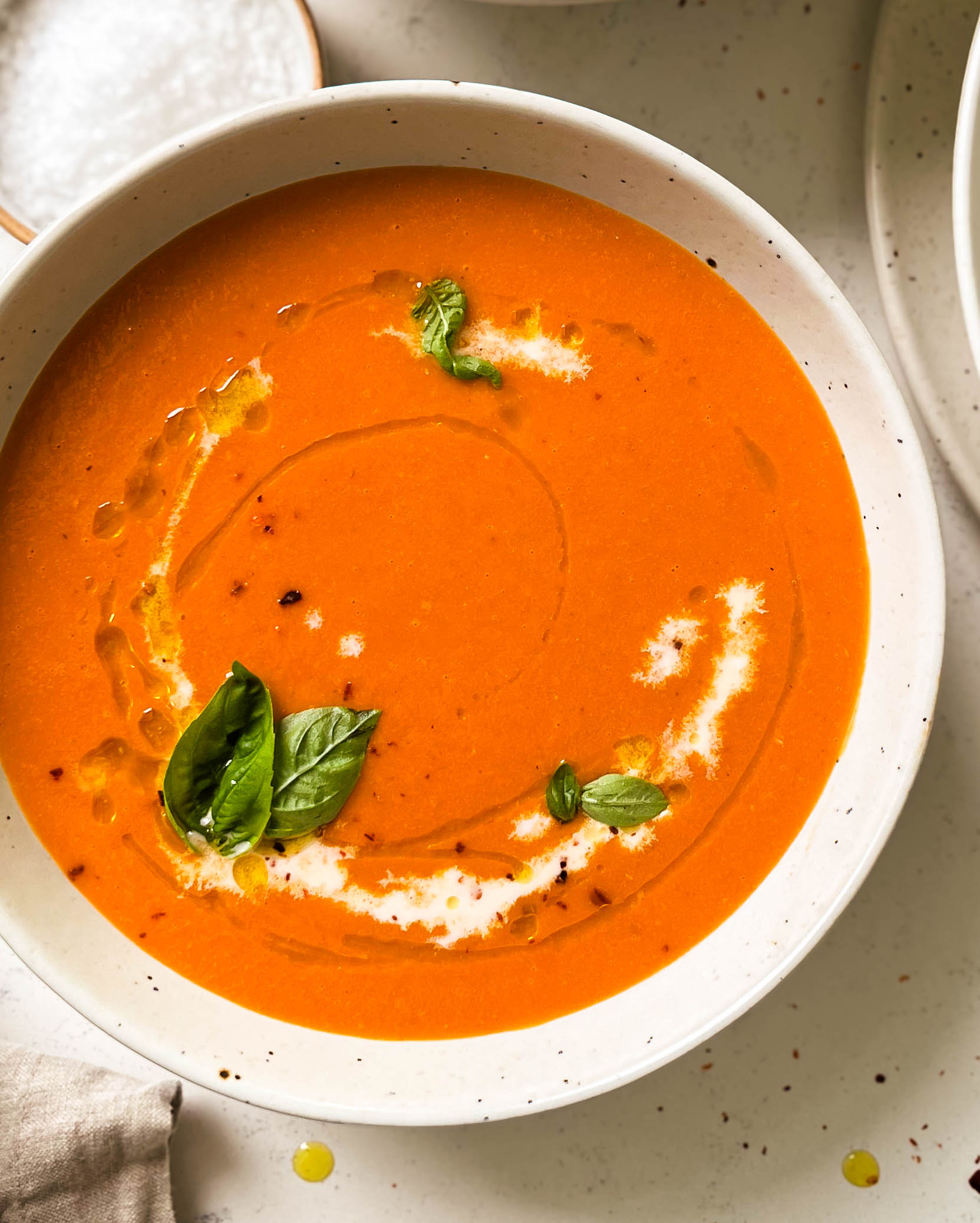 roasted tomato soup in a speckled bowl