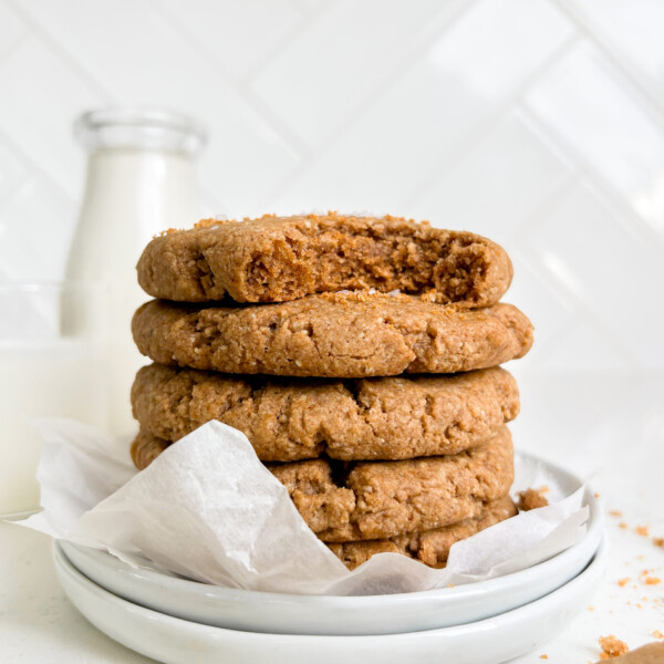 chewy vegan chai cookies stacked on top of a white plate