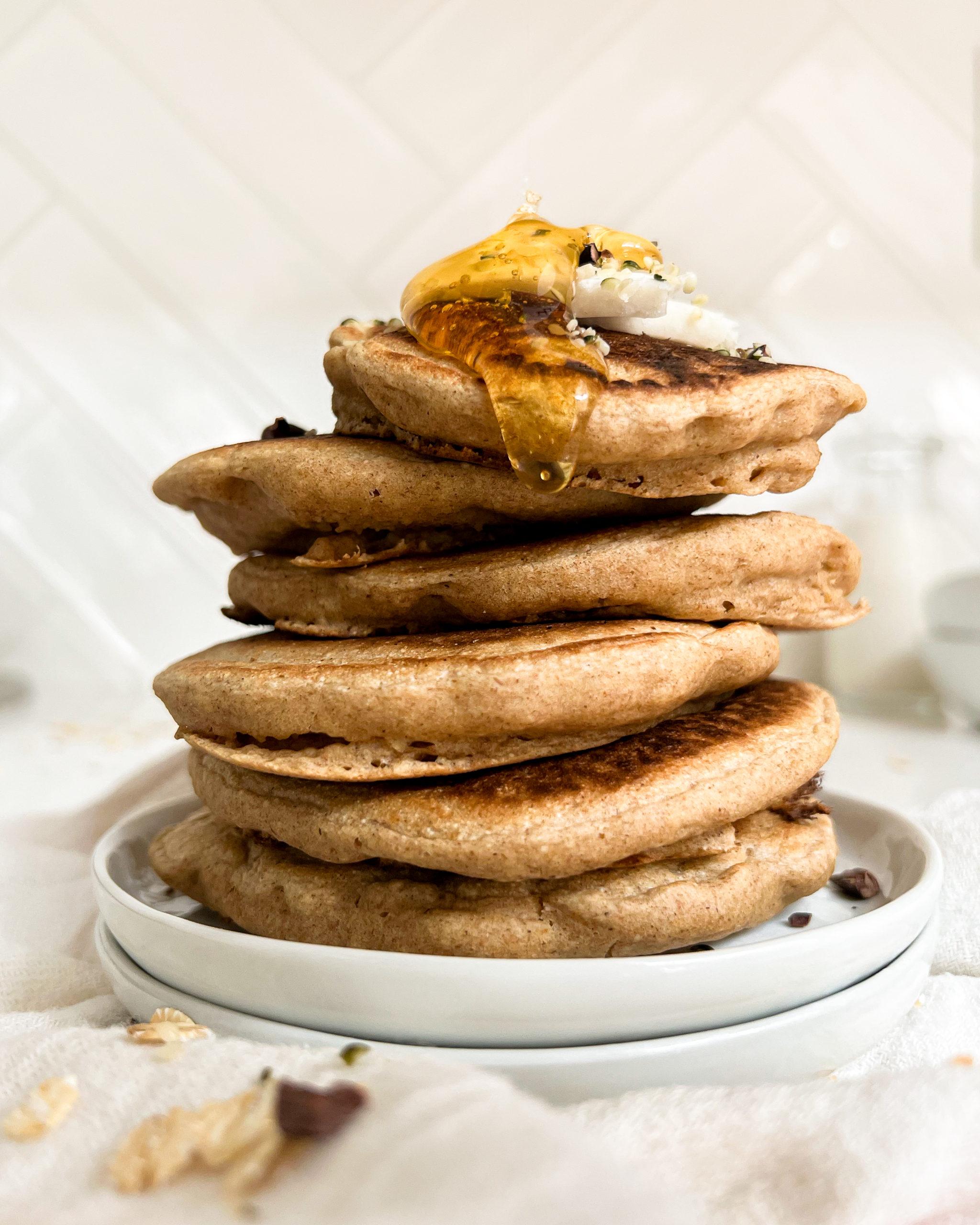 pancakes stacked on a white plate