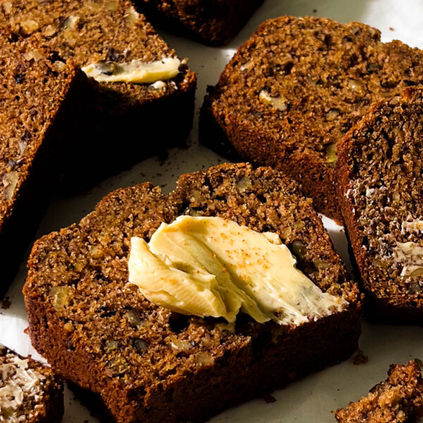 slices of vegan banana bread on parchment paper