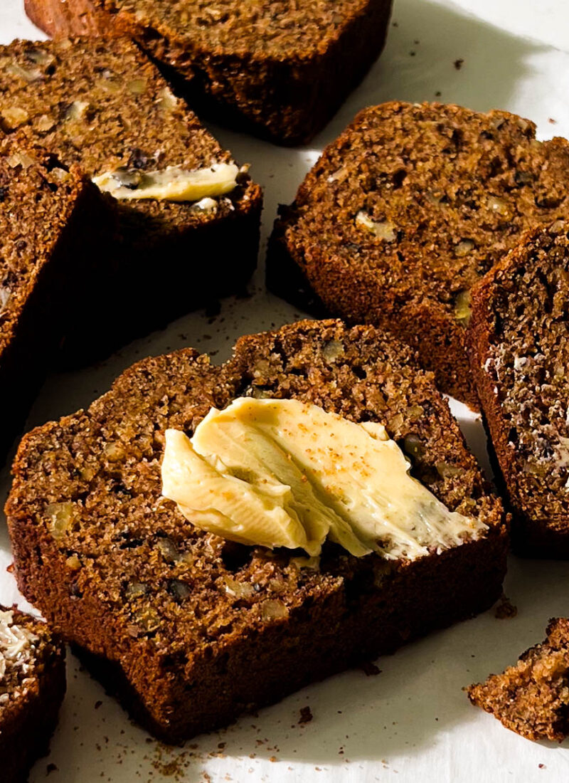 slices of vegan banana bread on parchment paper