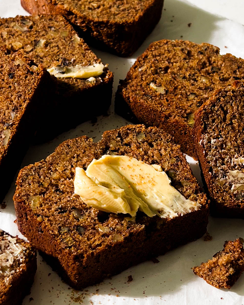 slices of vegan banana bread on parchment paper