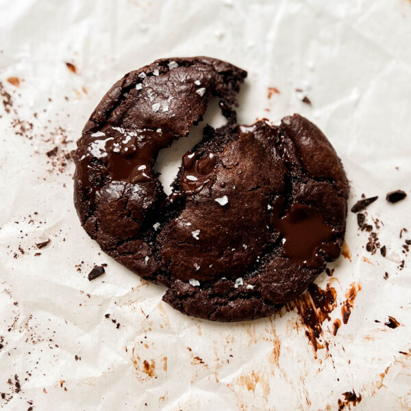 vegan double chocolate chip cookies on parchment paper