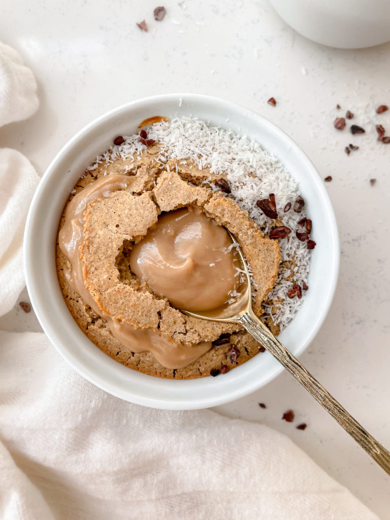 baked oats with caramel and spoon