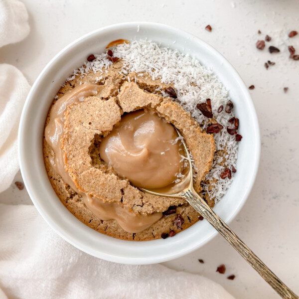 baked oats with caramel and spoon