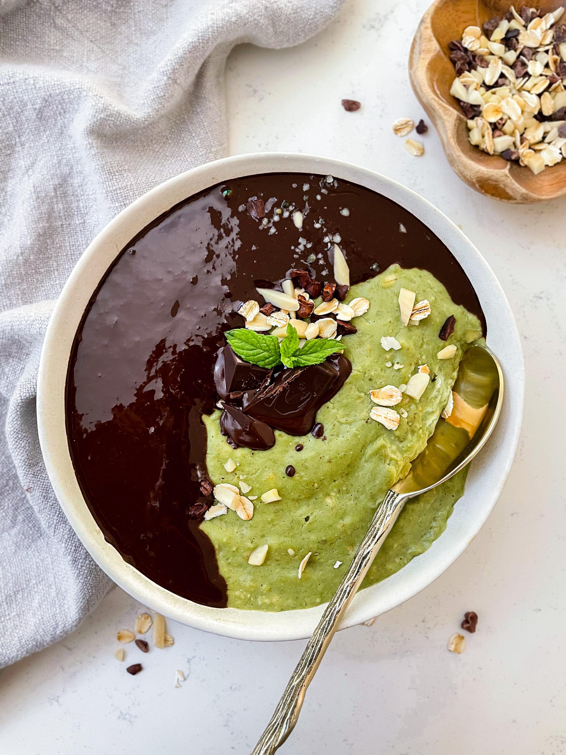 mint oatmeal topped with chocolate and chocolate ganache