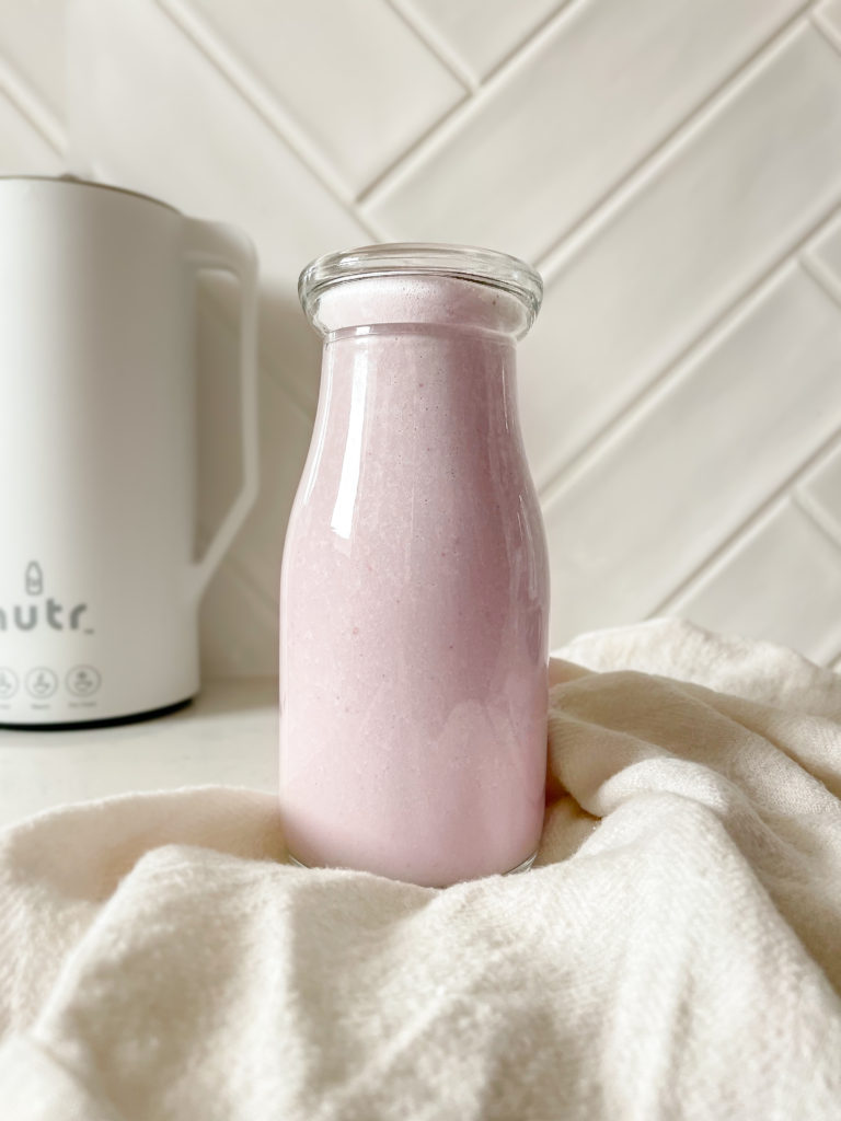 strawberry cashew milk in a jar 