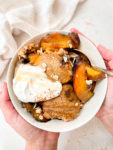 healthy peach cobbler baked oats made from oats, peaches and vegan coconut yogurt