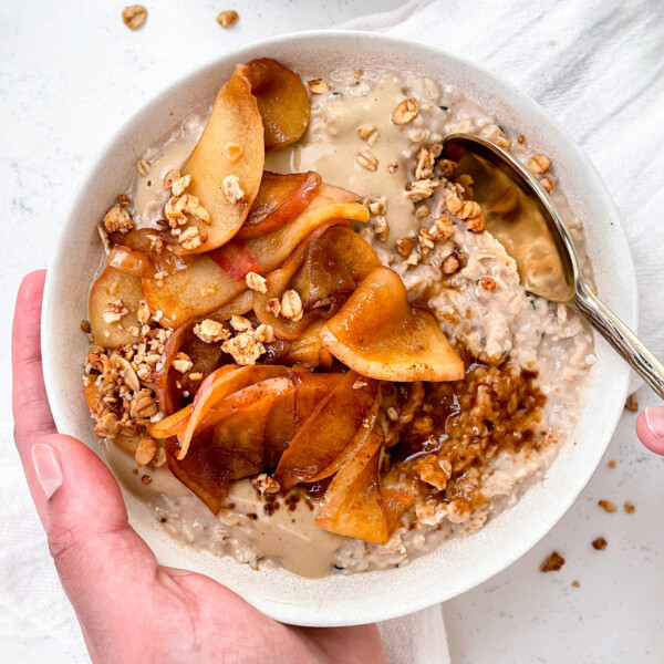 vanilla oatmeal with caramelized cinnamon sugar apples and sunflower butter on top