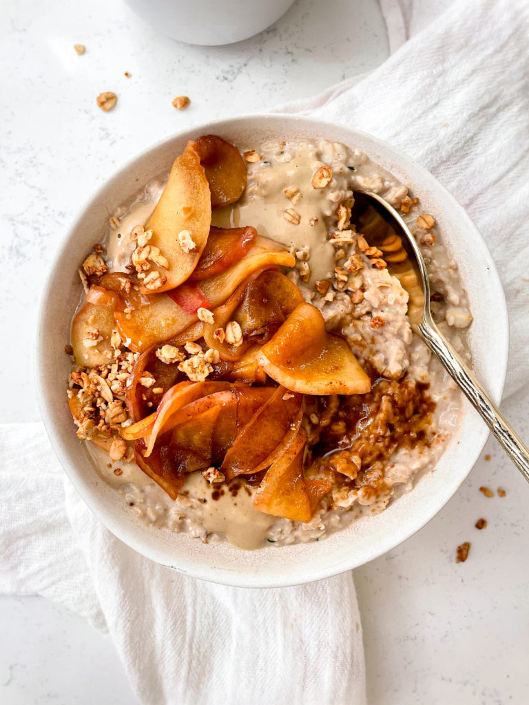 vanilla oatmeal with caramelized cinnamon sugar apples and sunflower butter on top