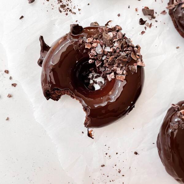 vegan chocolate baked donuts with chocolate glaze and flaky salt