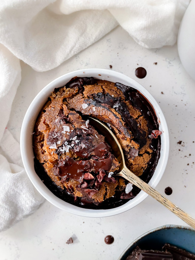 gingerbread baked oats with chocolate ganache and cacao nibs on top