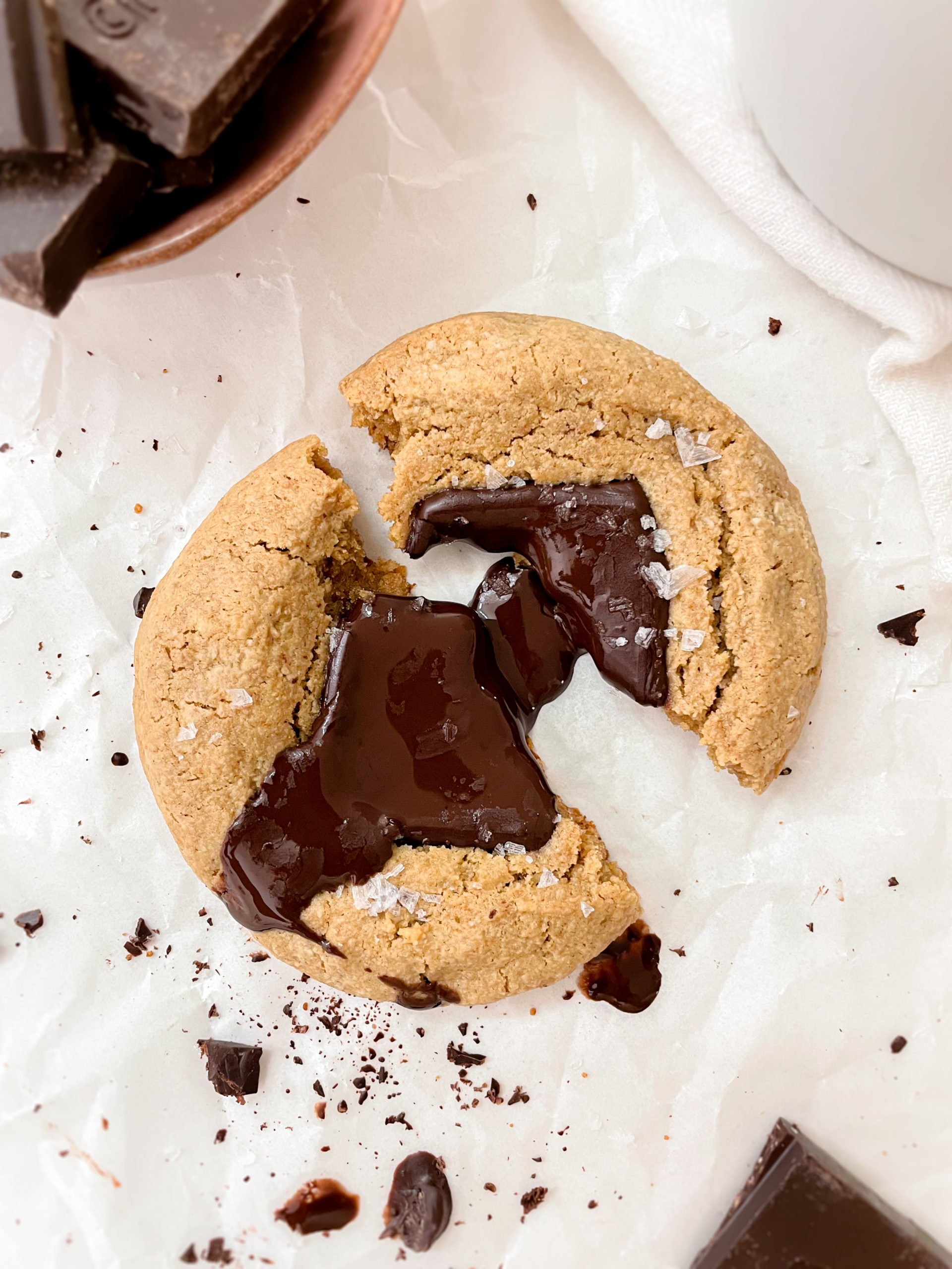 healthy cookie on parchment paper next to a bowl