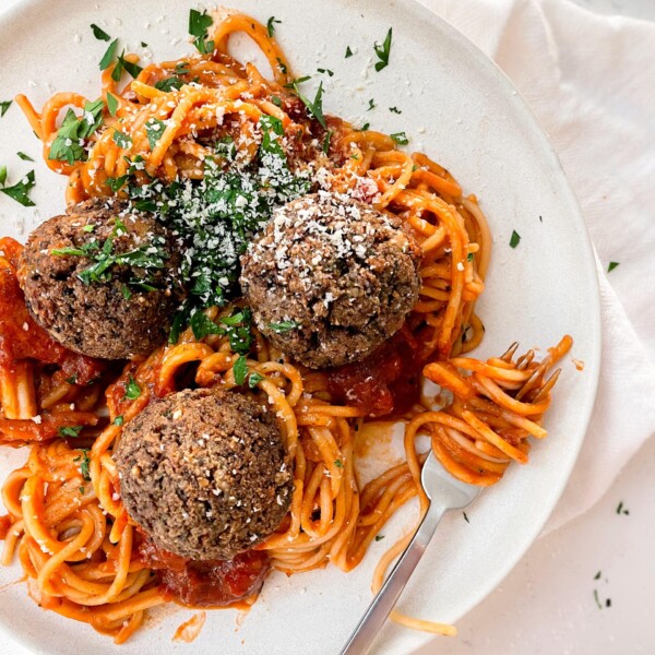 vegan tofu meatballs with spaghetti on a plate