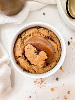 baked oats next to a plate and spoons and linen cloth