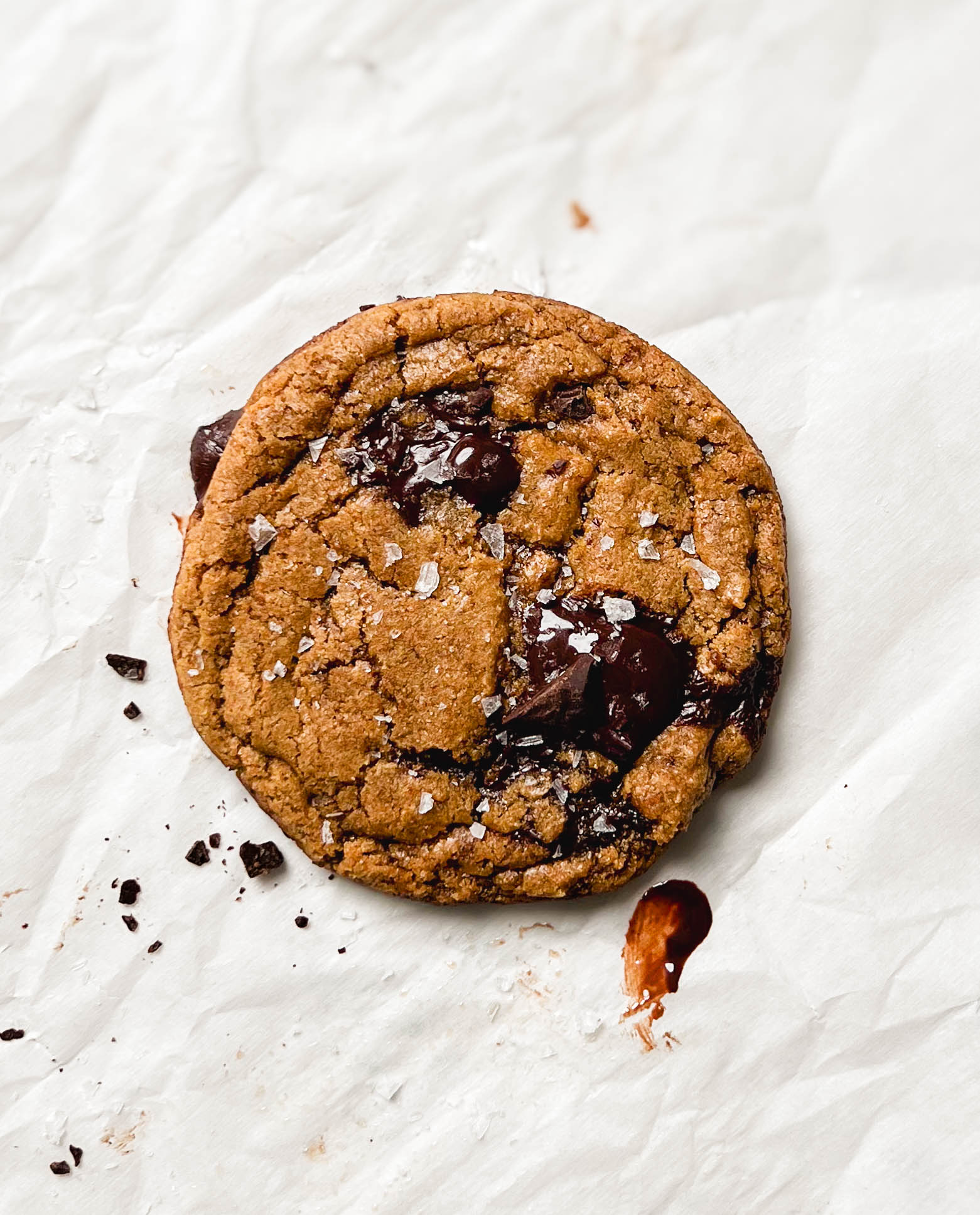 vegan single-serve chocolate chip cookie on parchment paper