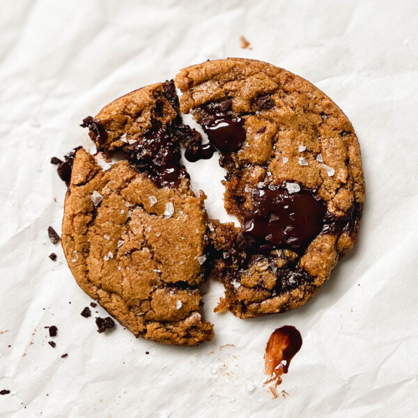 vegan single-serve chocolate chip cookie on parchment paper