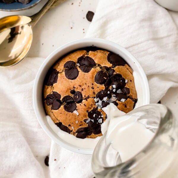 baked oats in a ramekin with milk poured into it