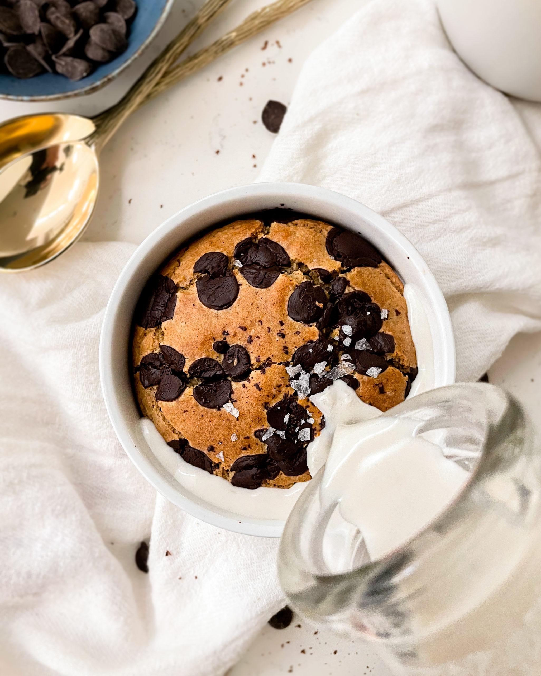 baked oats in a ramekin with milk poured into it