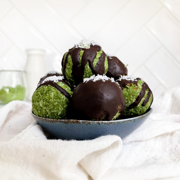 green energy bites in a blue bowl