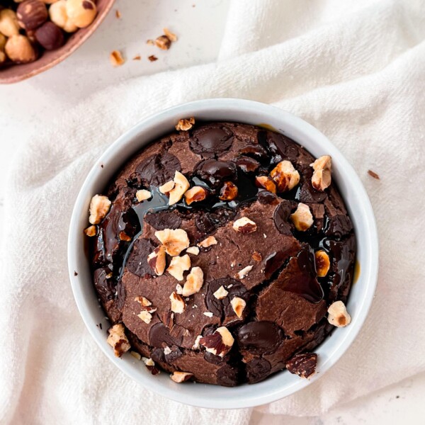 baked oats in a ramekin on a cloth