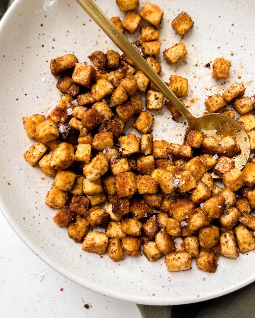 speckled plate of spicy and crispy baked tofu