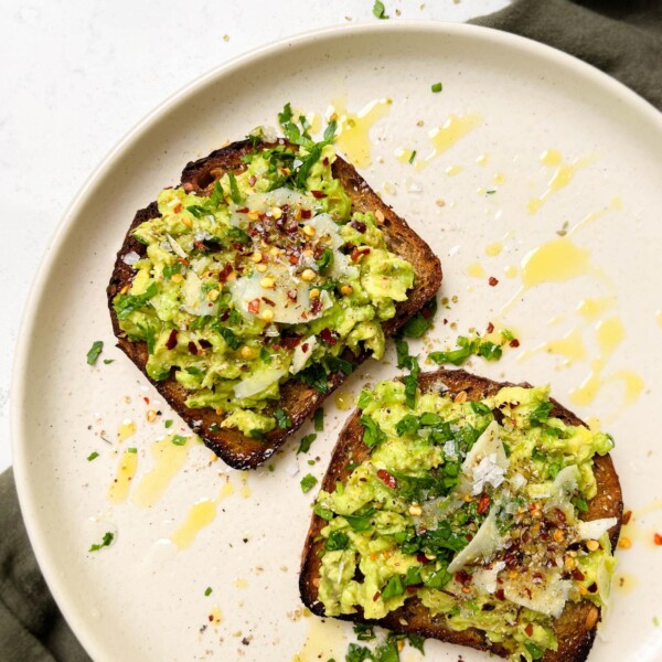 beige plate with avocado toast on top