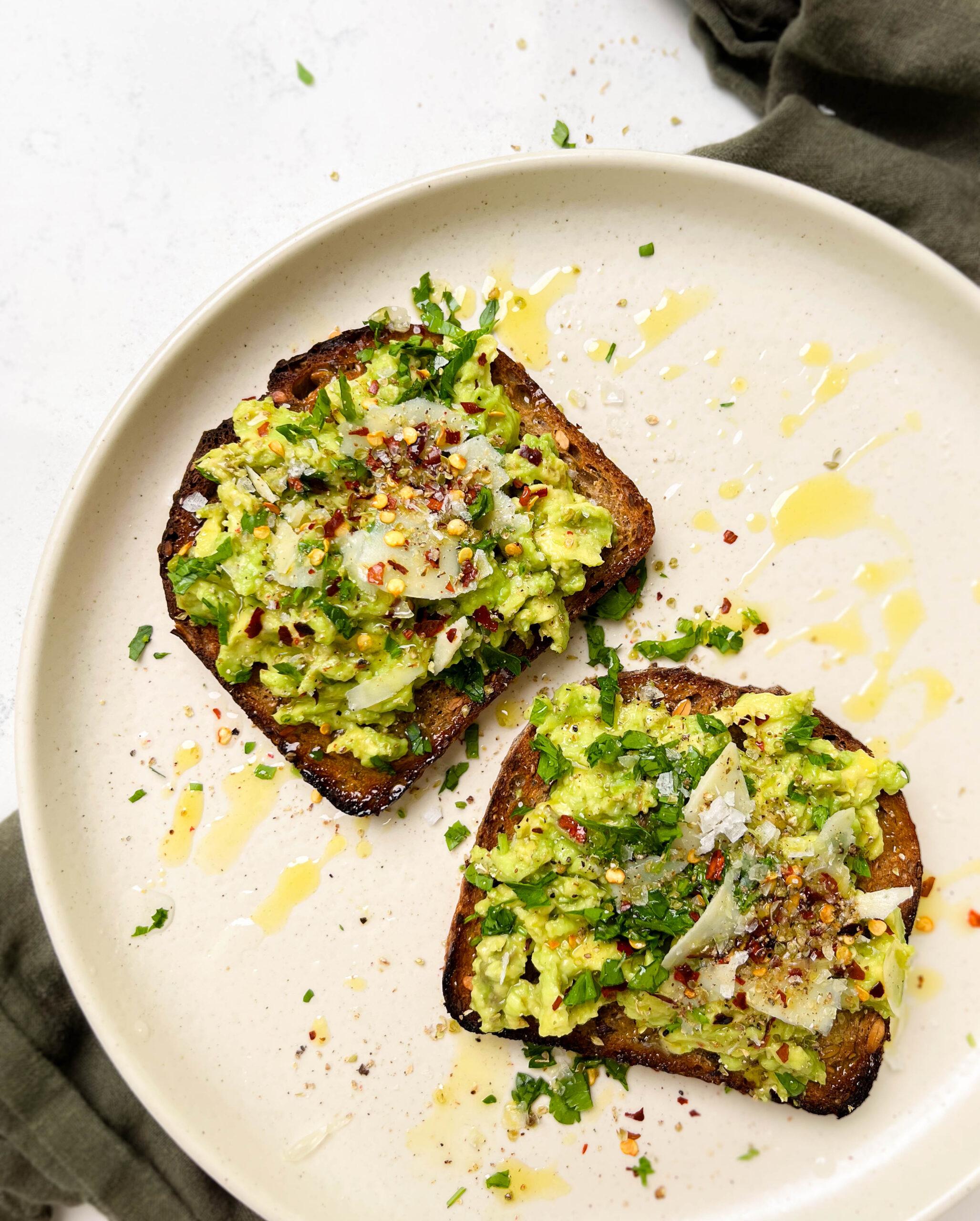 beige plate with avocado toast on top