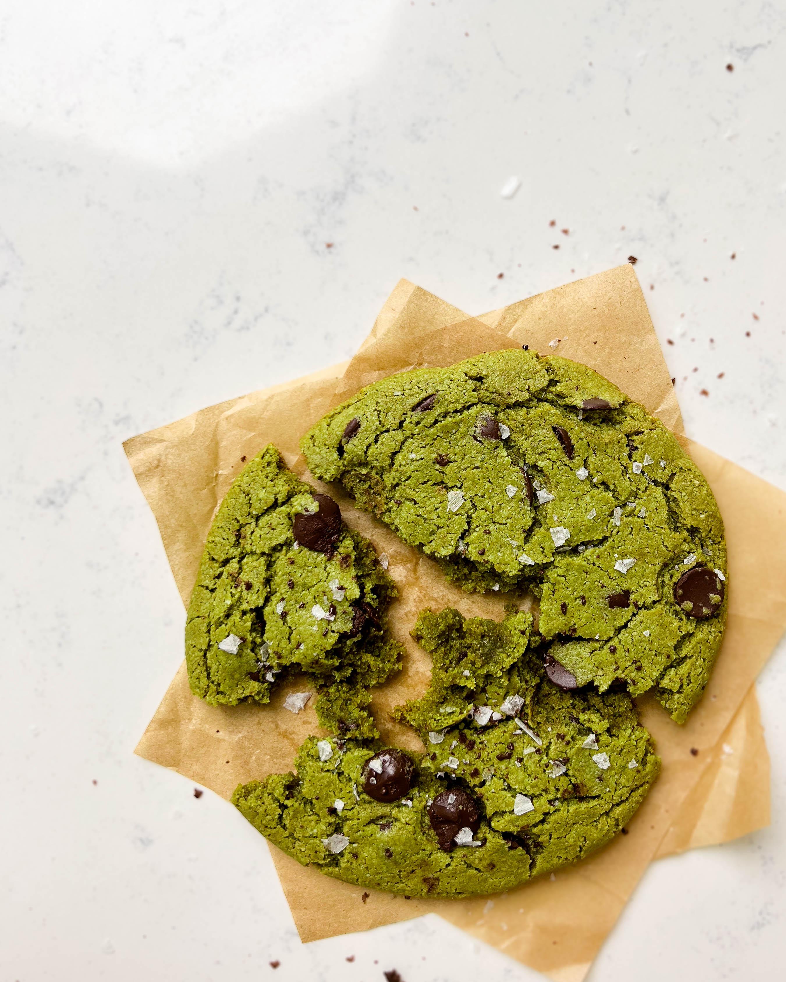 parchment paper with matcha chocolate chip cookie on top