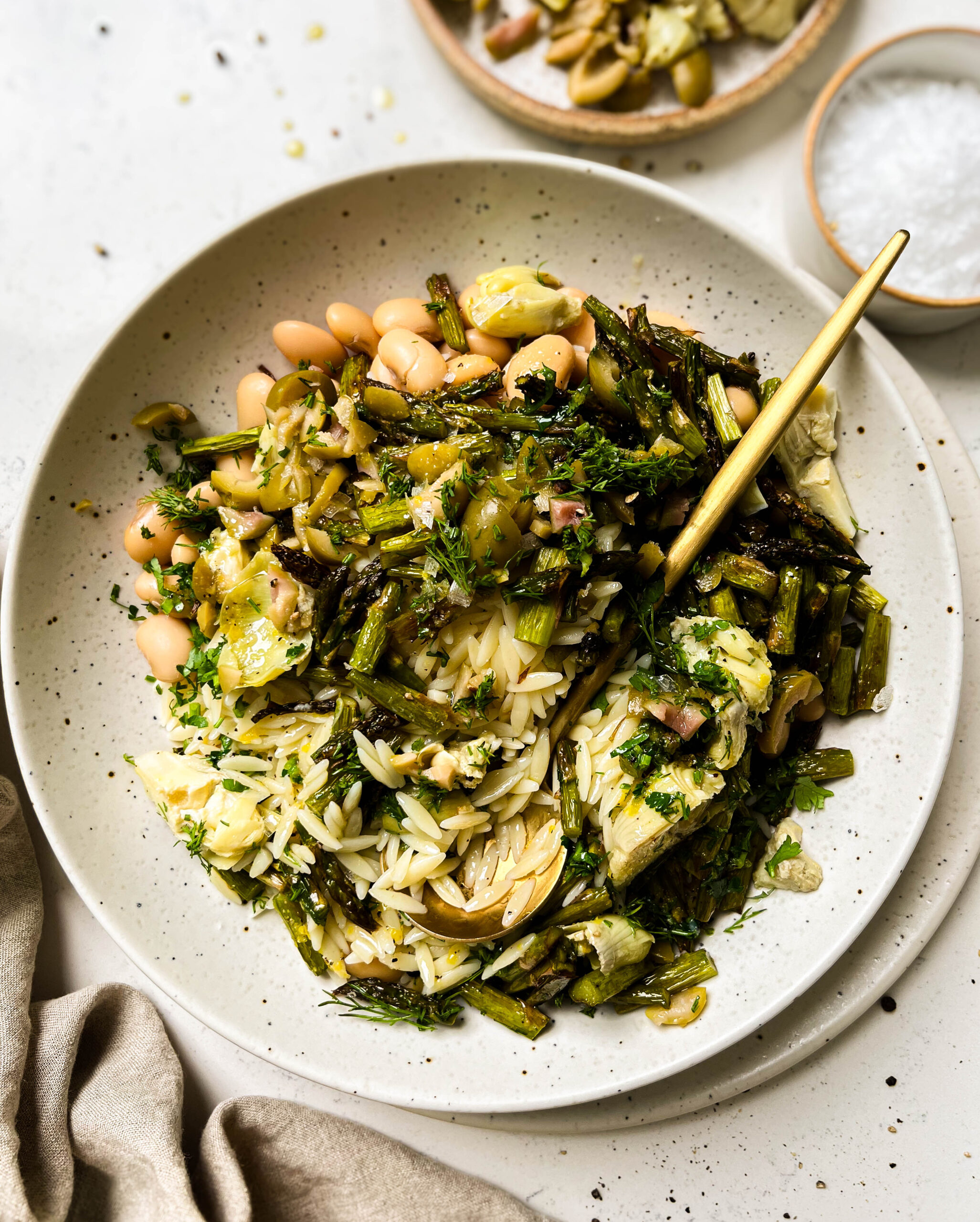 spring orzo pasta salad in a white bowl