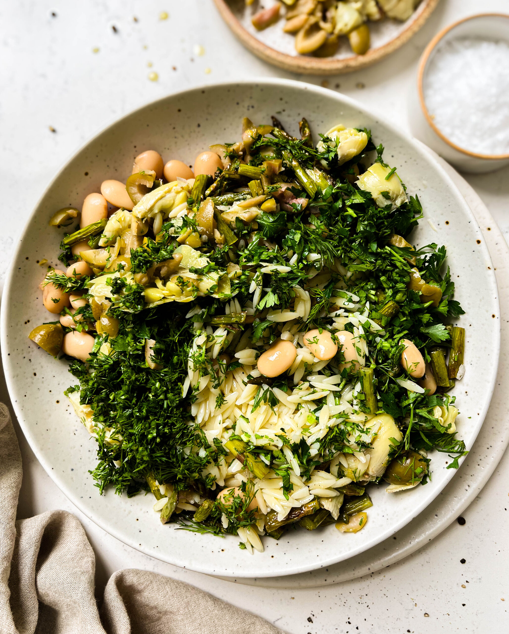 spring orzo pasta salad in a white bowl