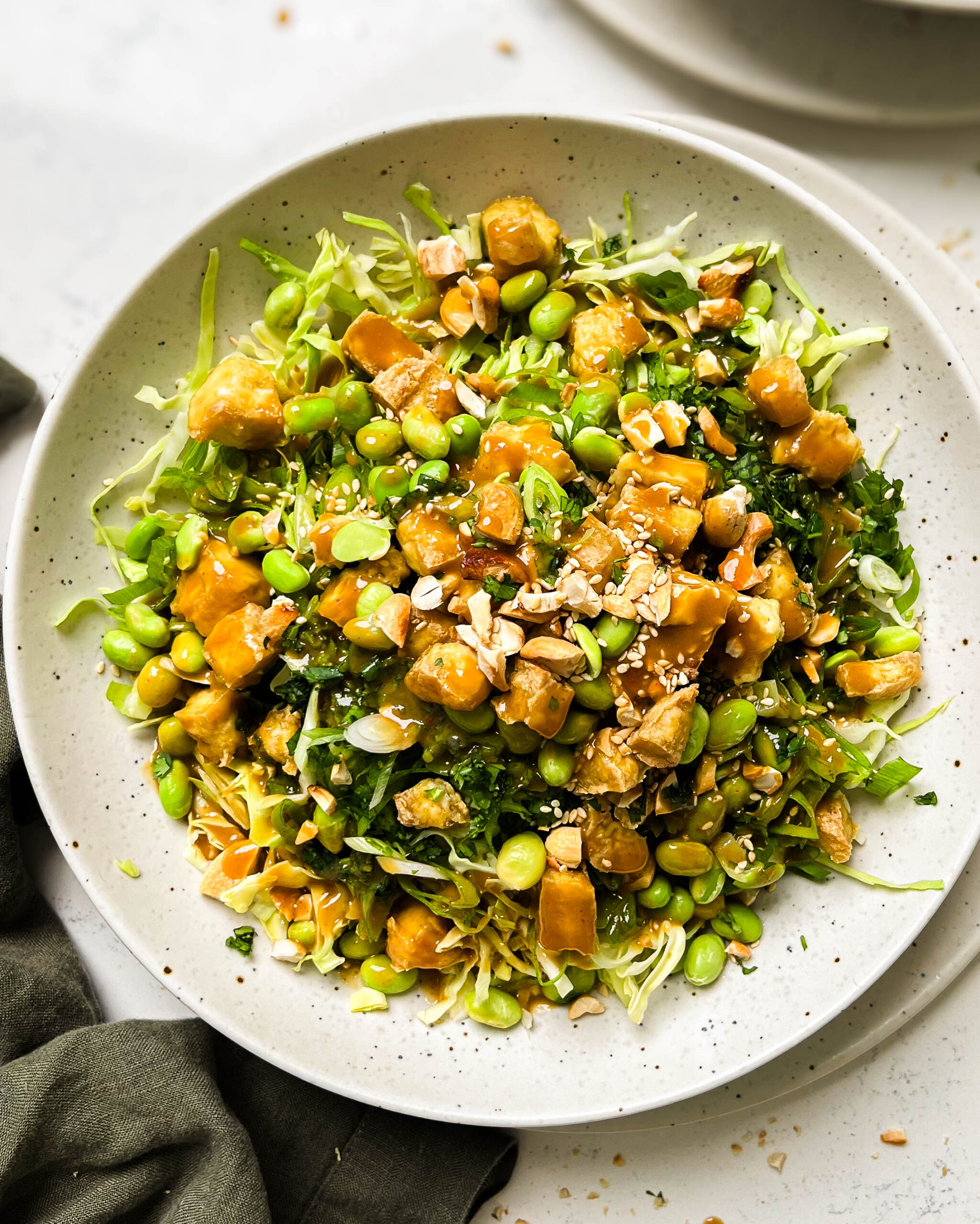 cashew crunch salad in a white bowl