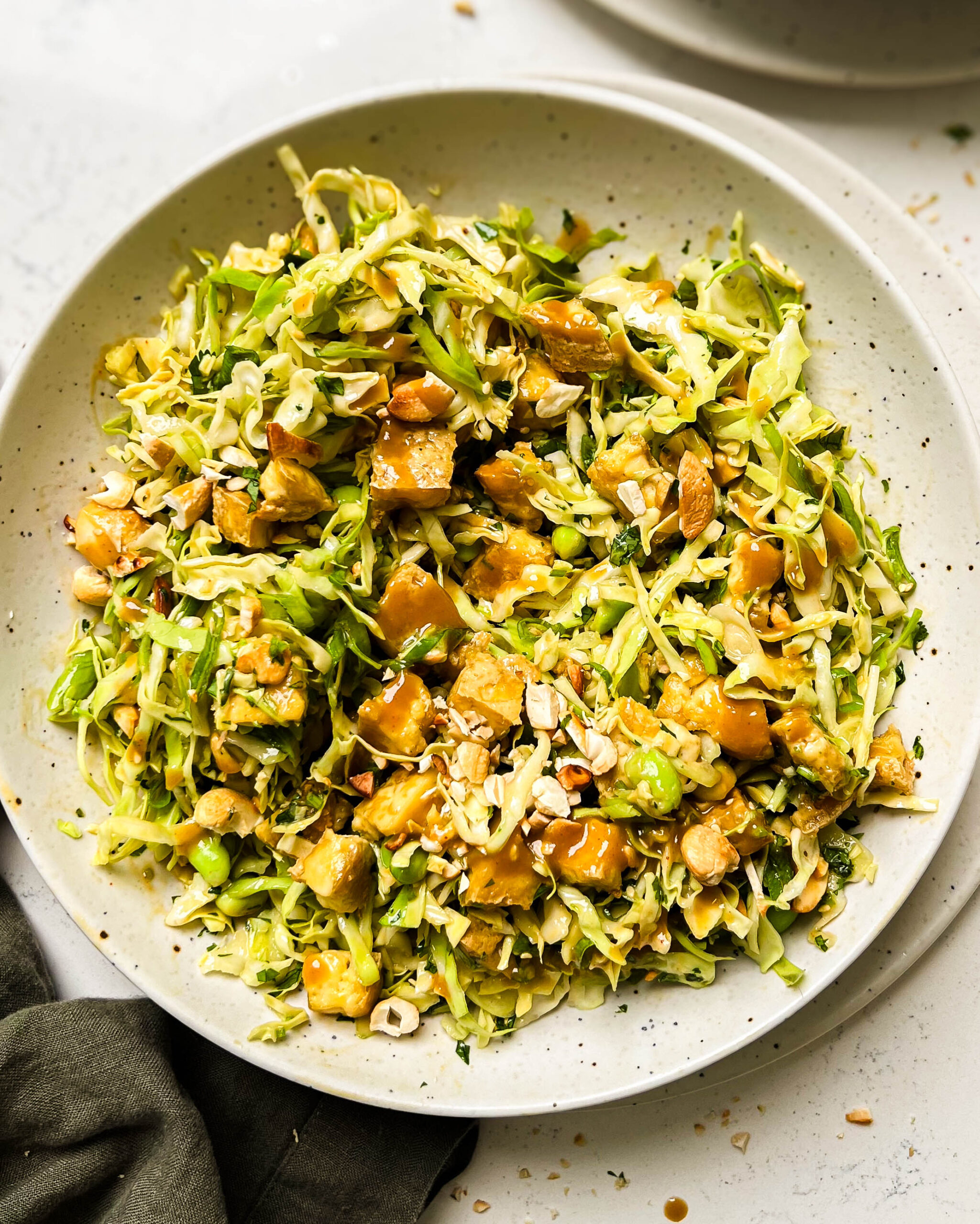 cashew crunch salad in a white bowl