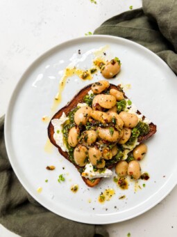 butter bean toast on a white plate