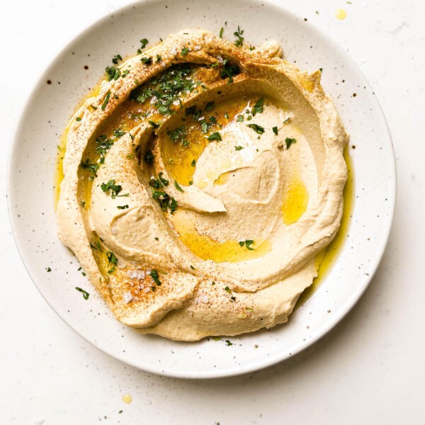 homemade hummus on a speckled plate