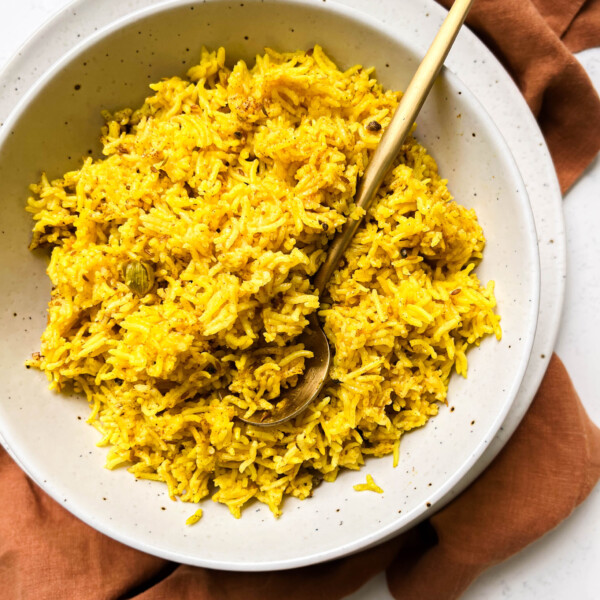 bowl of spicy rice on a brown linen cloth