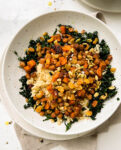 roasted fall harvest salad in a speckled bowl