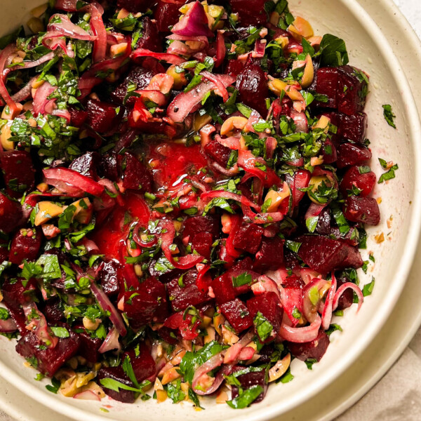 pickled beet salad in a beige bowl