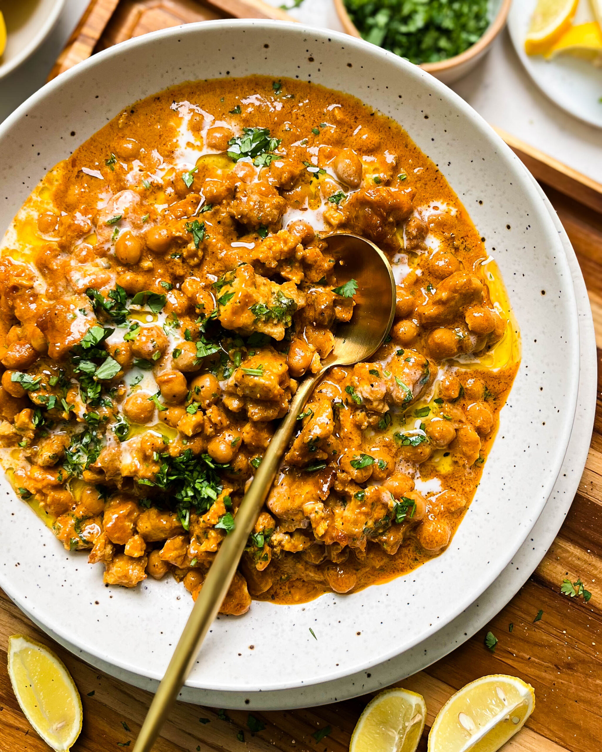 vegan butter chicken in a speckled white bowl 