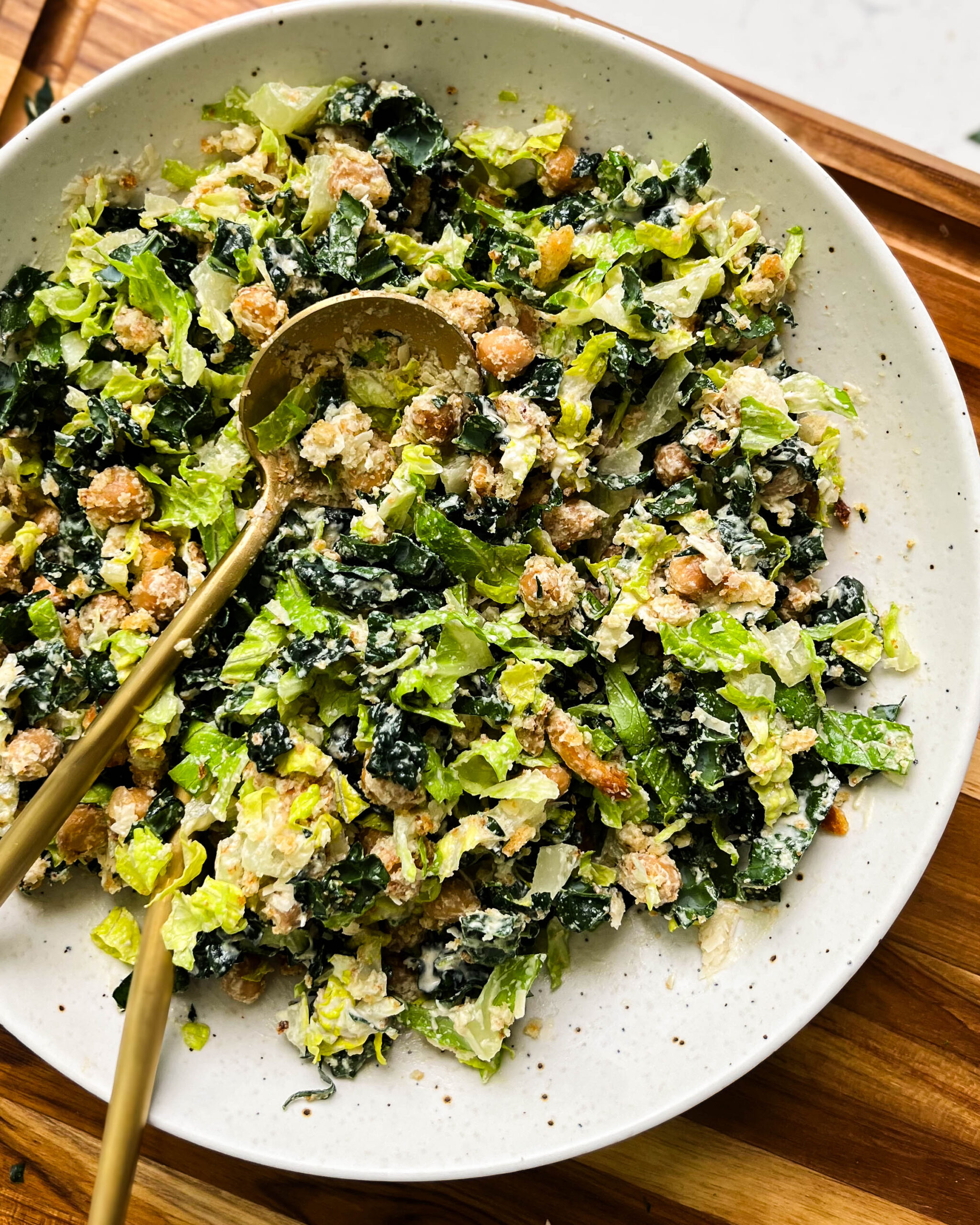 vegan kale caesar salad in a white bowl