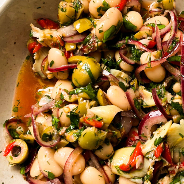 marinated butter beans in a white bowl