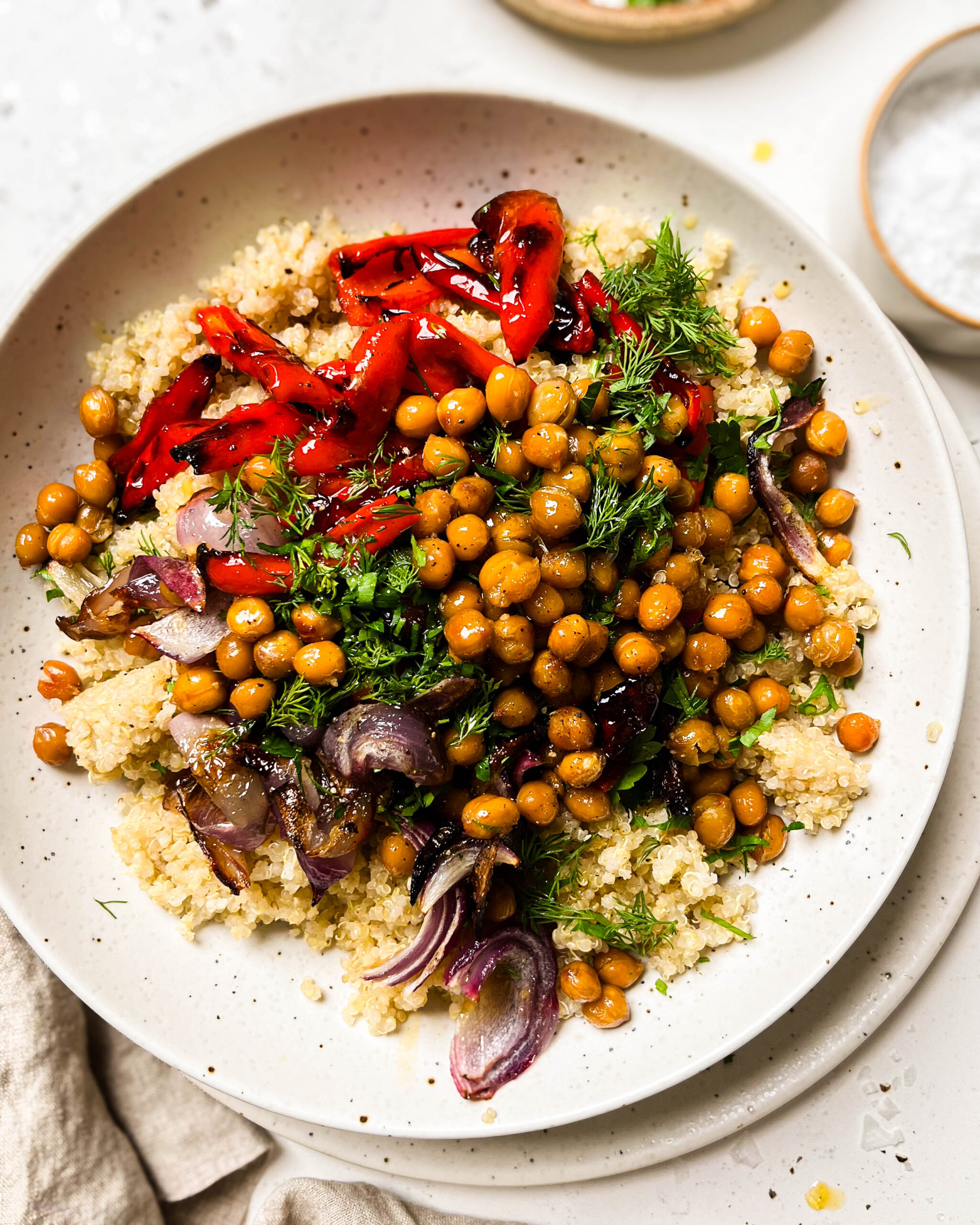 roasted red pepper salad in a white bowl