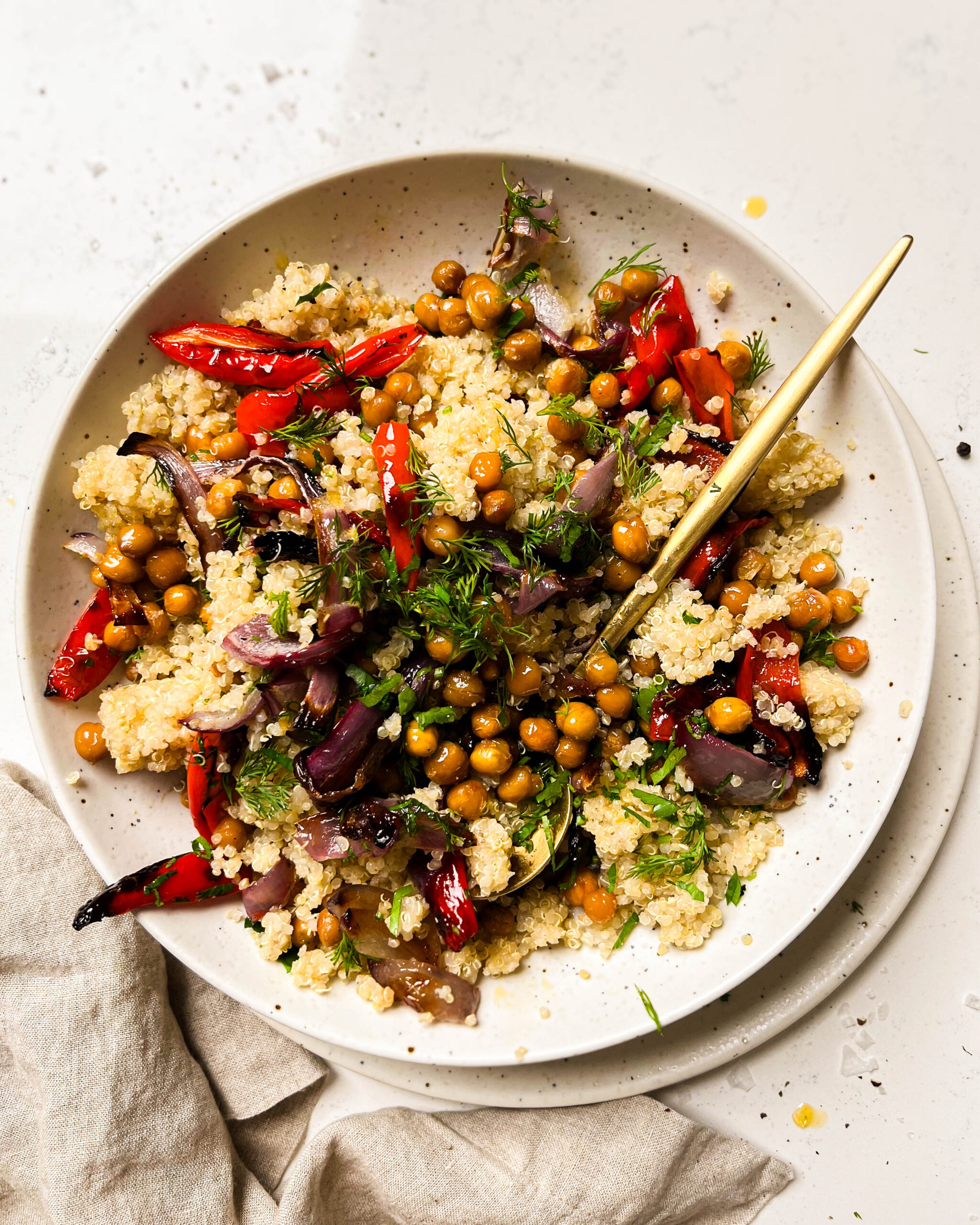 chickpea and roasted red pepper salad in a white bowl