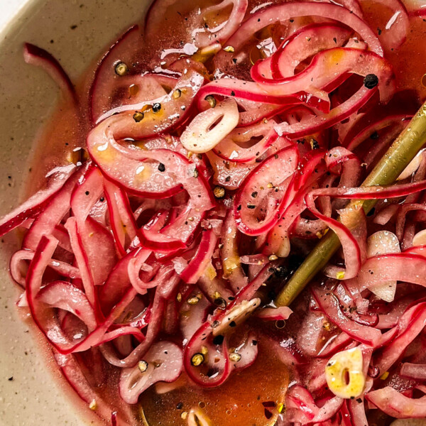 pickled onions in a white bowl