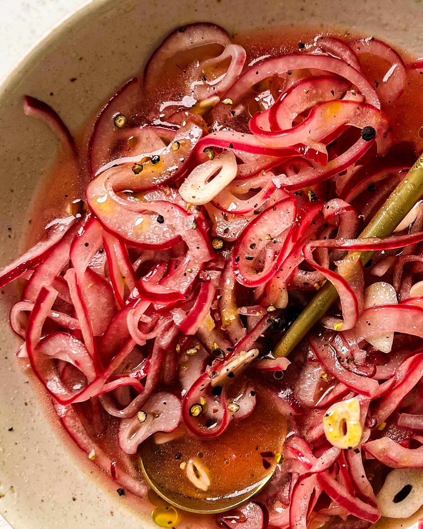 pickled onions in a white bowl
