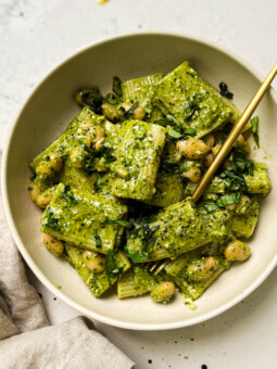 vegan pesto pasta in a beige bowl