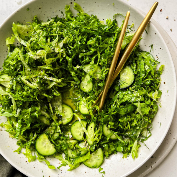 pickled cucumber salad in a white bowl