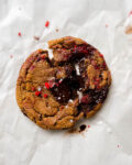 raspberry chocolate chunk cookie on parchment paper